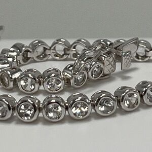 Lenox .925 Silver and round Clear, Topaz stones bracelets.